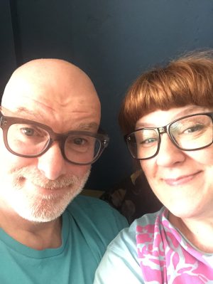 picture of our two smiley faces and both wearing glasses.