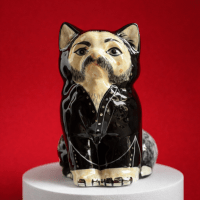 A ceramic cat figurine inspired by Lemmy the frontman of Motorhead